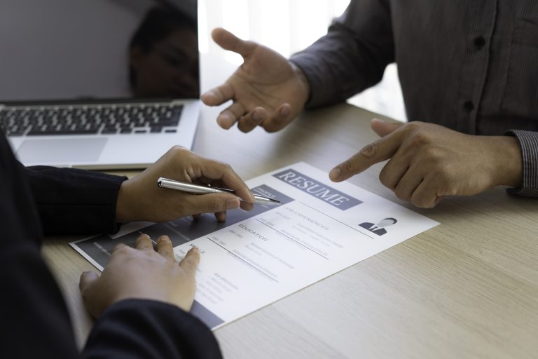 Male job applicants are explaining in detail their work history and Talent to job interviewers written on resume, job interview inquiry ideas.